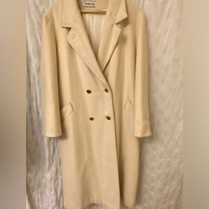 Rock your vintage lifestyle with this Herman Kay white wool coat.Size 14.